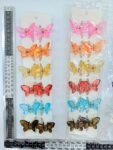 F – 008 pinza mariposa cristal chica par en tira C12 pares 3B-19